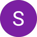 Purple circle with white letter S inside.